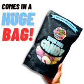 Large bag of freeze dried salt water taffy held in hand